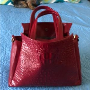 Beautiful Red Satchel with matching wallet.